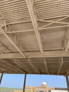 ceiling of building with spray fireproofing applied