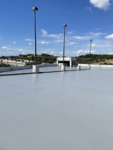 Flat roof coating by Alpha Insulation & Waterproofing.